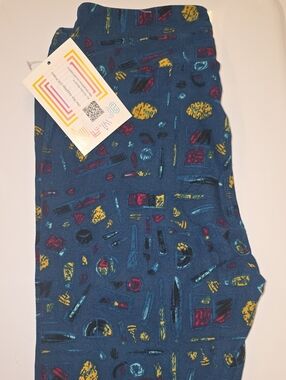 LuLaRoe Teal Blue Leggings with Yellow, Red & Black Makeup Print